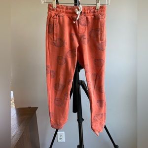 Mini Boden orange sweatpants with blue pufferfish